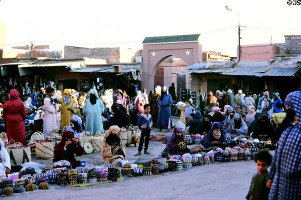 Women knitting caps for sale in souk. Marrakesh, Morocco.
