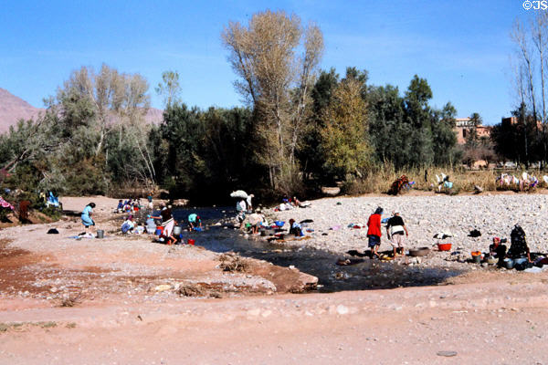 Women doing laundry at Gorge du Todra. Morocco.