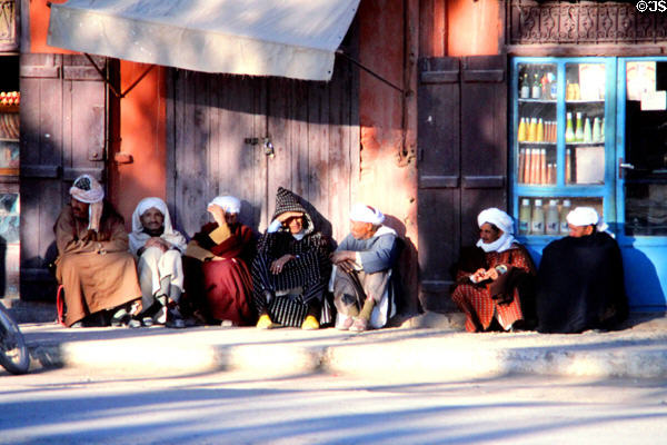 Men in traditional dress in souk. Erfoud, Morocco.