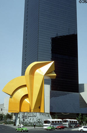 Bright yellow El Caballito sculpture in front of Torre Caballito (34 floors) skyscraper on Paseo de la Reforma. Mexico City, Mexico.