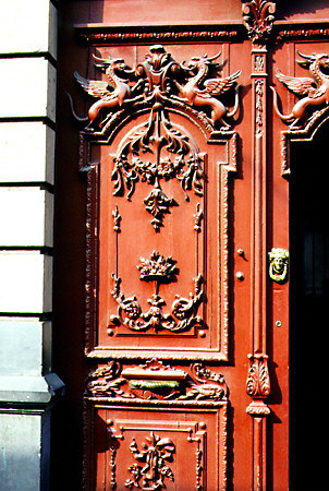 Detail of a red carved door in Puebla. Mexico.