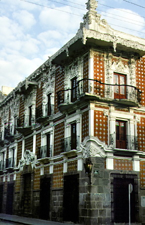 The red & white architecture of Casa Del Alfeäique, Almond-Cake House, in Puebla. Mexico.