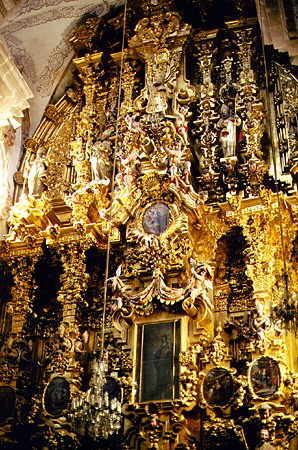 The painted & gilded Churrigueresque interior of church of Santa Prisca, Taxco. Mexico.