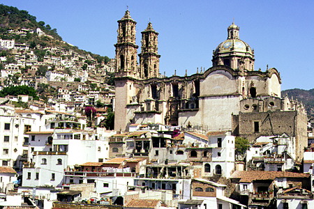 View of town of Taxco & its church from afar. Mexico.