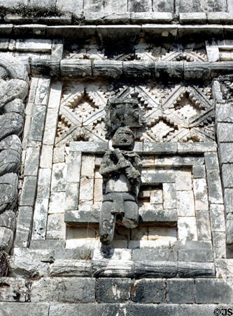 One of native carved sculptures on a building in Nunnery Quadrangle at Uxmal. Mexico.