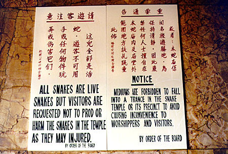 Warning sign on snake temple on Penang island. Malaysia.