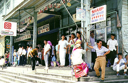 People in front of shops in Beaufort market. Malaysia.