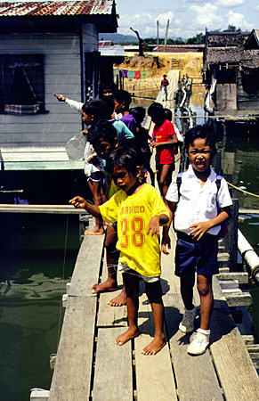 Children in Mengkabong water village on island of Borneo. Malaysia.