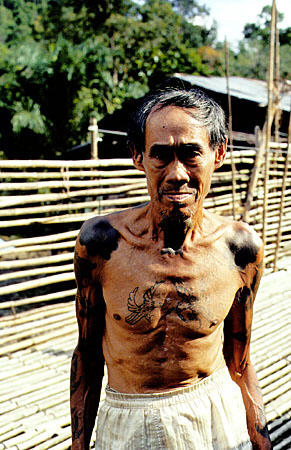 Tattoos of an old warrior from Ugat longhouse in Sarawak. Malaysia.