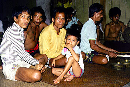 People watching dancers at Ugat longhouse in Sarawak. Malaysia.