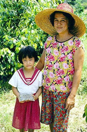 Mother and daughter on drive to Skrang Pepper Plantation in Sarawak. Malaysia.