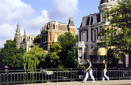 Houses along Singelgracht canal across from Rijksmuseum. Amsterdam, Netherlands.