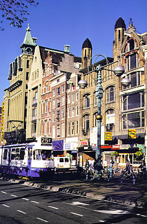 Buildings along Damrak, central street of Amsterdam. Amsterdam, Netherlands.