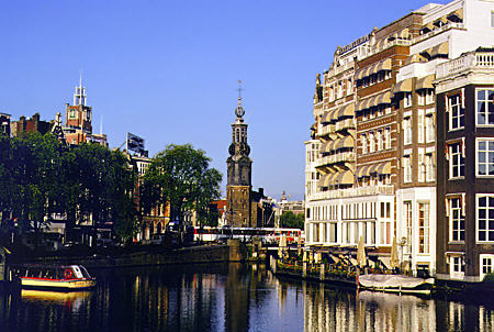 Munttoren built in 1619 seen from Amstel River. Amsterdam, Netherlands.