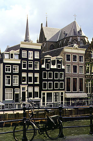 Buildings on Herengracht in front of De Krijberg church. Amsterdam, Netherlands.