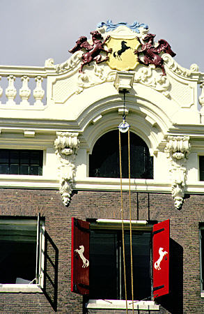 Stallions decorate gable of house on Herengracht. Amsterdam, Netherlands.