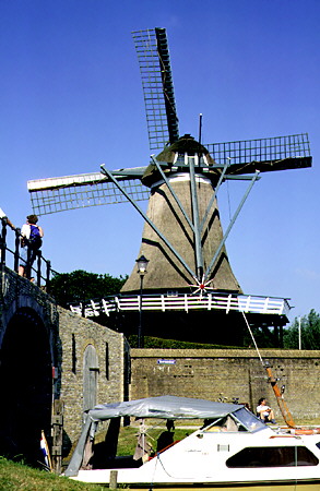 Windmill beside a bridge. Sloten, Netherlands.
