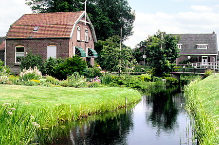 Houses along canal in Westbroek. Westbroek, Netherlands.