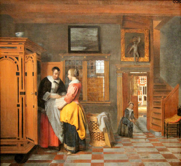Interior with women beside a linen cupboard painting (1663) by Pieter de Hooch at Rijksmuseum. Amsterdam, NL.