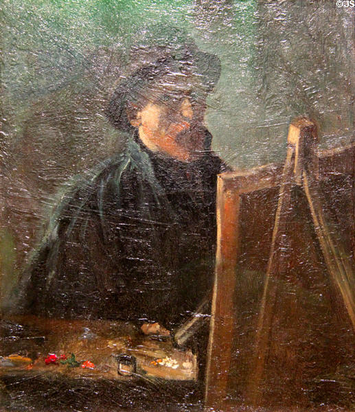 Self-portrait as painter in hat with field easel (1887) by Vincent van Gogh at Van Gogh Museum. Amsterdam, NL.