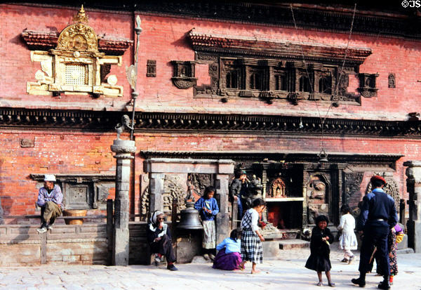 Children in front of ornate building between Dattatraya & Durbar Squares, Bhaktapur. Nepal.