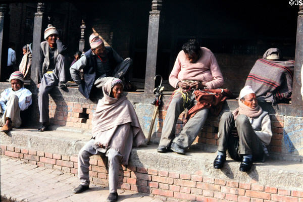 Men sitting in sun in Katmandu. Nepal.