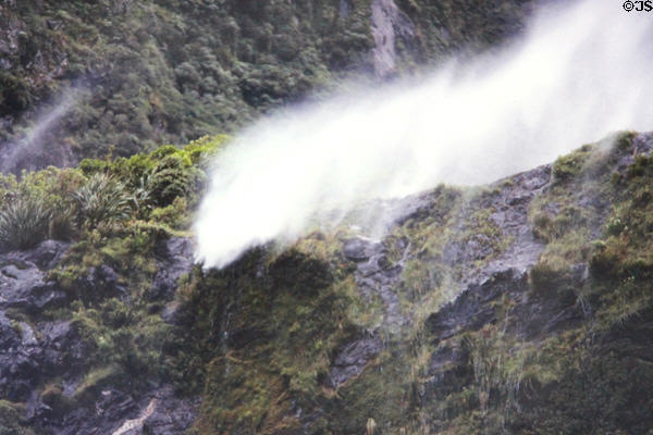 Strong updrafts keep waterfall from falling in Milford Sound. New Zealand.