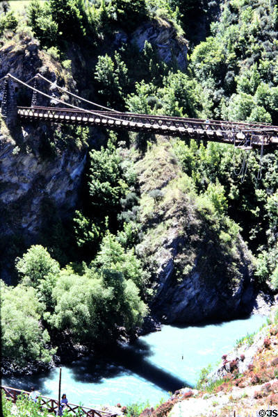 Kawarau suspension bridge (1880) by Harry Higgison over canyon drop. New Zealand.