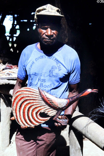 Artist of a carved rooster in Tambanam. Papua New Guinea.