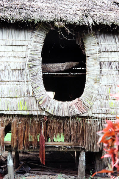Window on the side of a house Tambaran in Wambun. Papua New Guinea.
