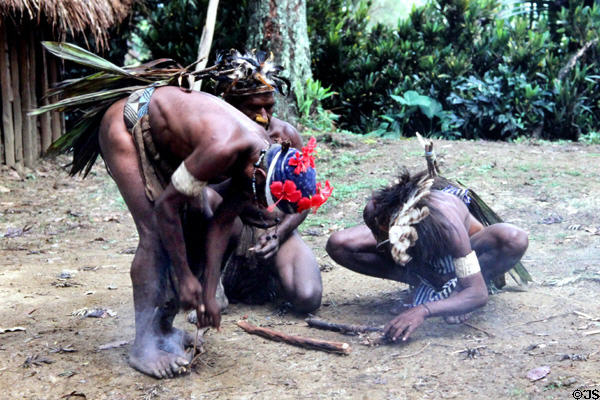 Demonstrating how to start fire with friction at Chimbu village. Papua New Guinea.
