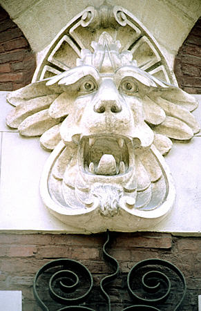 Singing lion with long eyebrows detail on house at 1 Uliczce Retoryka by Teodor Talowski in Krakow. Poland.