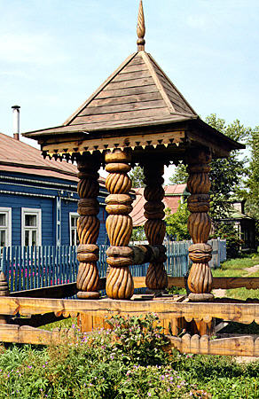 Intricately carved wooden well in Suzdal. Russia.