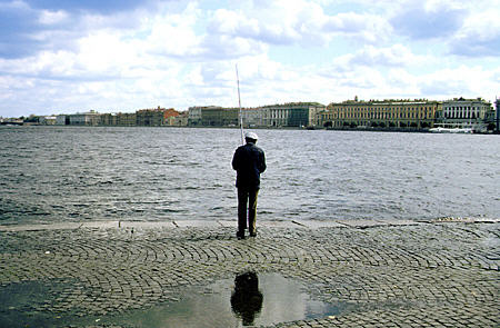 Man fishing before Winter Palace in St Petersburg. Russia.