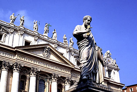 Statue of St Peter & facade of St Peter's Church in Vatican. Vatican City.