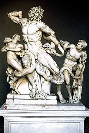 Death of Laocoon in Vatican Museum features priest of Apollo crushed to death along with sons by snakes part of Lacuane Group (Laocoön) by artists from Rhodes (1C BCE). Vatican City.