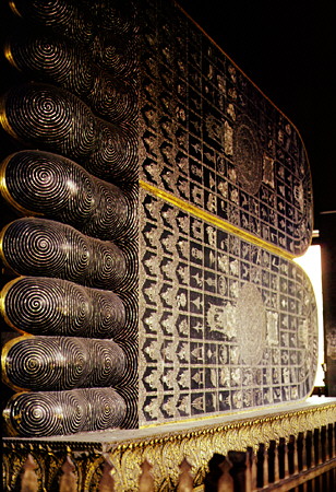 The intricately inlaid 1.5m-high feet of the reclining Buddha in Wat Pho, Bangkok. Thailand.