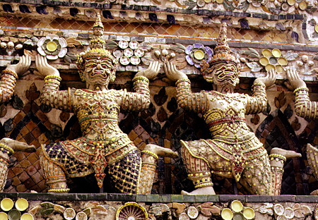 Wat Arun (Temple of Dawn) is covered with Chinese porcelain and numerous figures in Bangkok. Thailand.