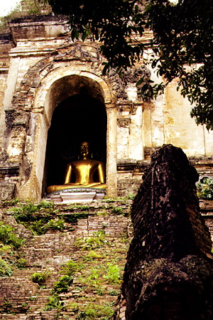 Buddha at Wat Chedi Luang in Chiang Mai, now in partial ruins. Thailand.