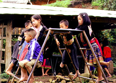 Meo tribal school children at play in a village north of Chiang Mai. Thailand.