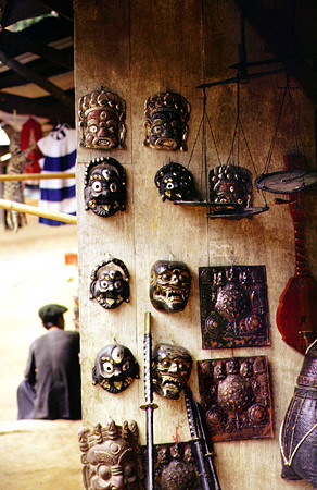 Variety of wood carvings including masks for sale in a Meo tribal village north of Chiang Mai. Thailand.