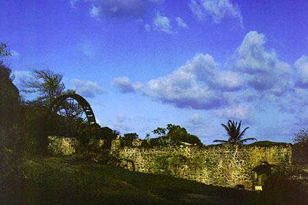 Old mill wheel at Speyside. Trinidad and Tobago.