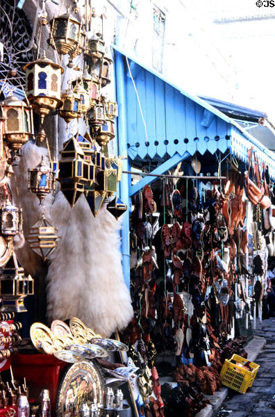 Shops with lamps & leather shoes in Medina. Tunis, Tunisia.