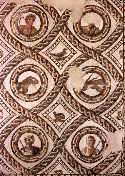 Roman mosaic tile floor with scrolled borders framing portraits & animals at Bardo Museum. Tunis, Tunisia.