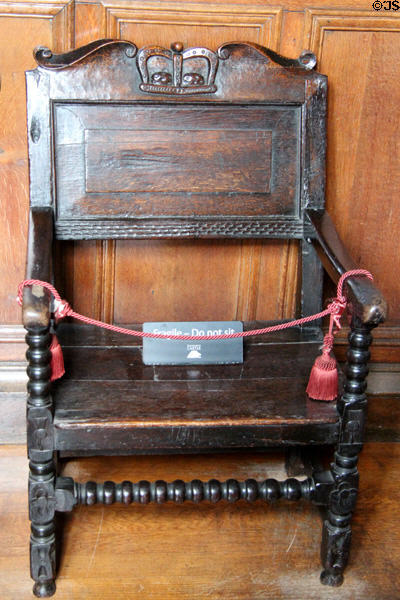 Oak armchair in birth chamber of King James VI & I in royal apartments at Edinburgh Castle. Edinburgh, Scotland.