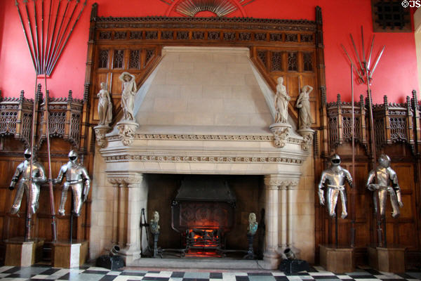 Fireplace flanked by suits of armor in Great Hall at Edinburgh Castle. Edinburgh, Scotland.