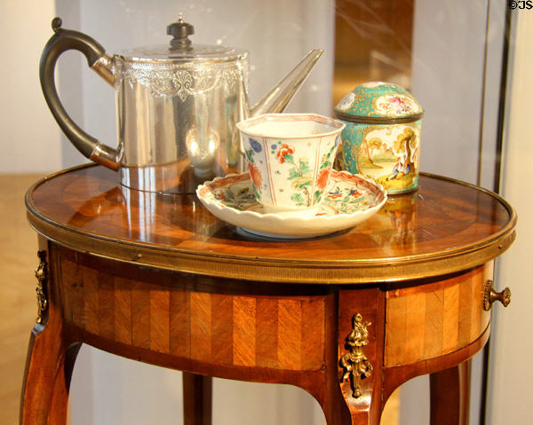 Silver teapot (1782-3) by Patrick Robertson of Edinburgh with porcelain tea cup & jar at City Art Centre. Edinburgh, Scotland.
