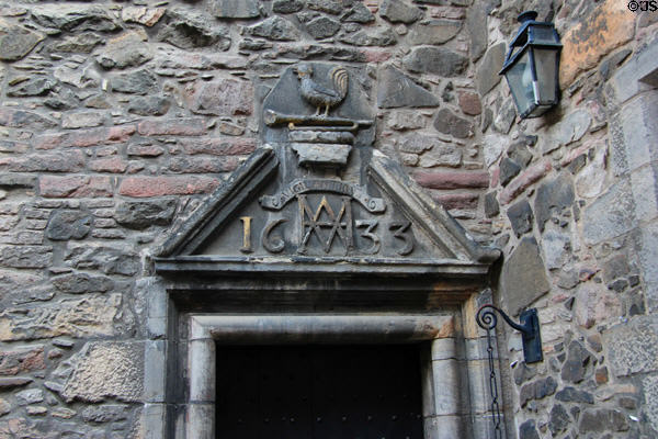 Museum of Edinburgh carved doorway pediment (1633) on courtyard off Bakehouse Close. Edinburgh, Scotland.