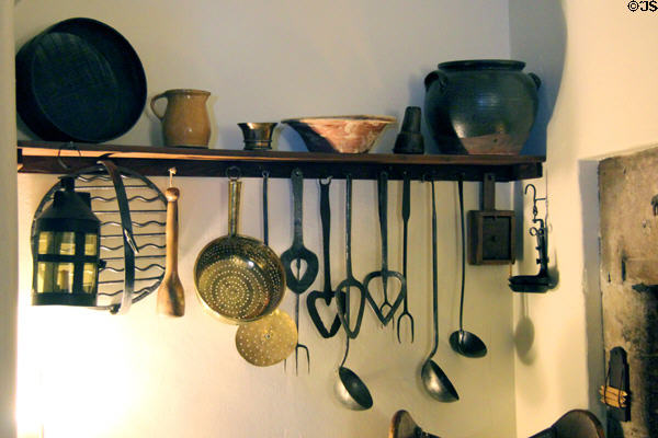 Kitchen utensils including bannock rack with waved grate at Gladstone's Land tenement house. Edinburgh, Scotland.