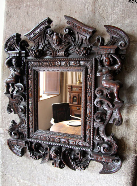 Carved mirror (17thC) in painted chamber at Gladstone's Land tenement house. Edinburgh, Scotland.